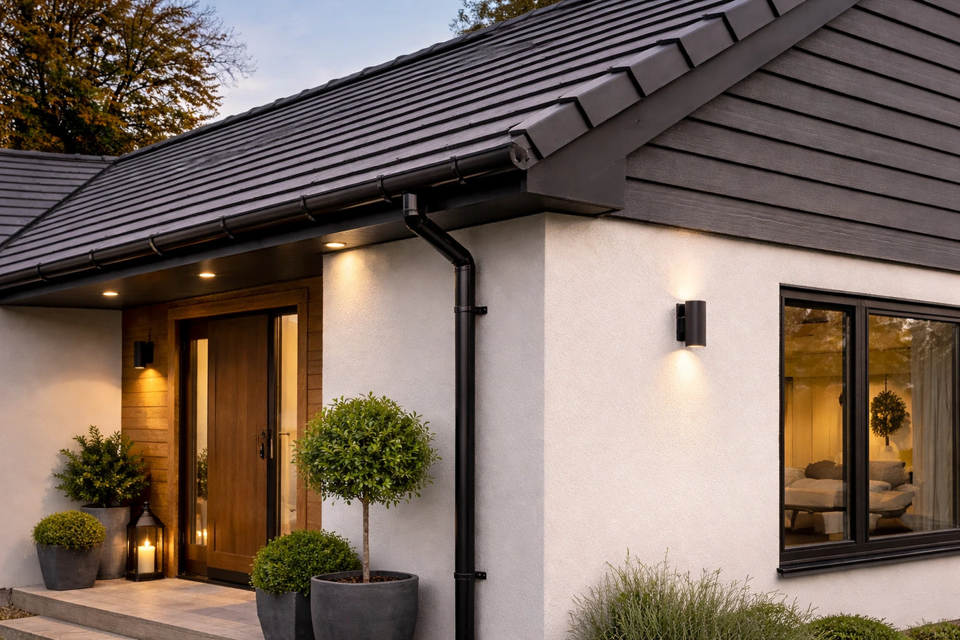Modern UK house exterior with clean roofline and guttering